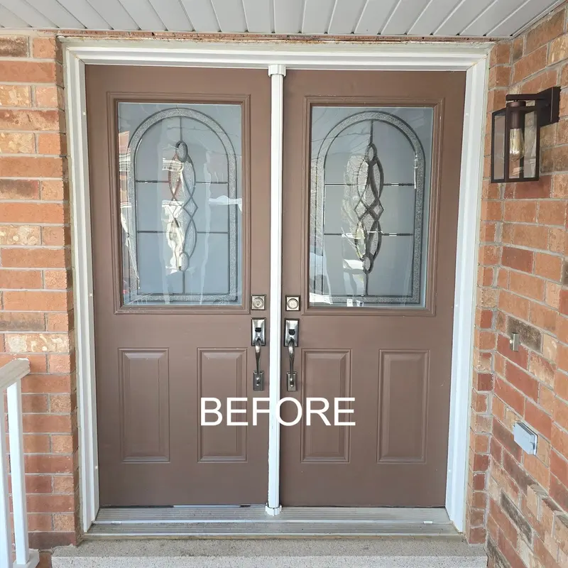Before: old double front doors with oval glass